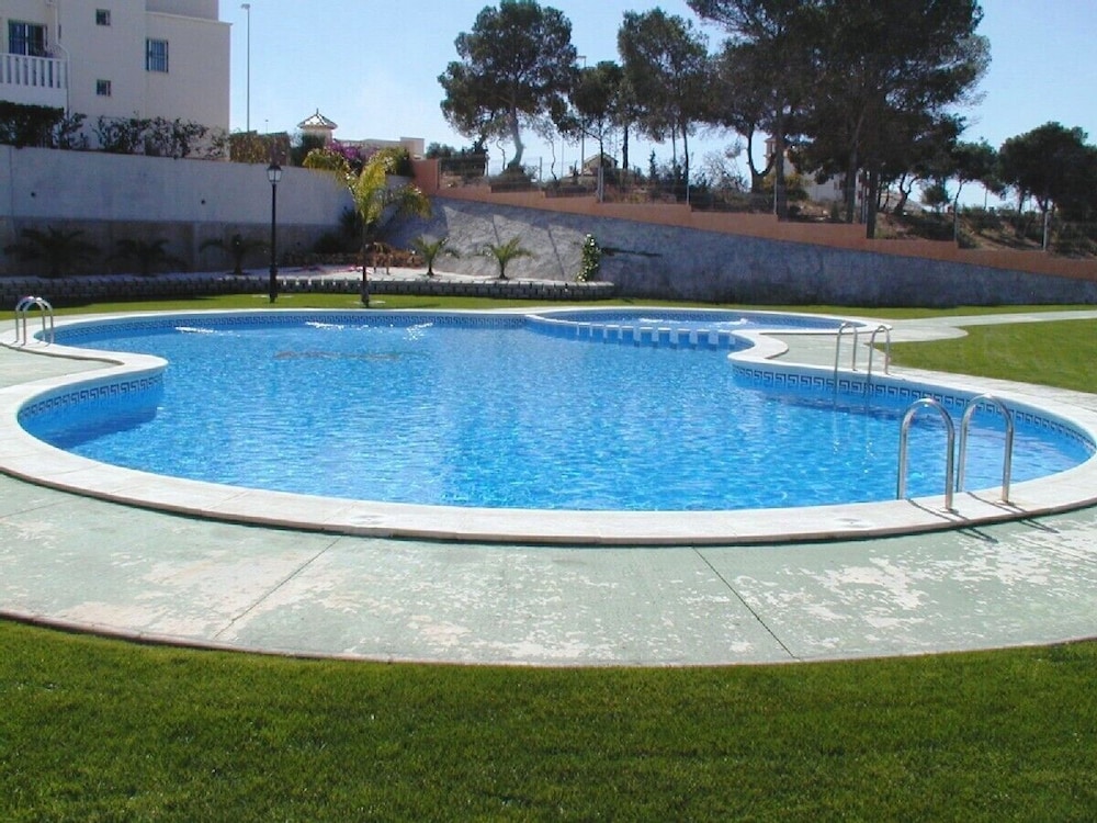 Two bed apartment with balcony, sun terrace, pool and sea views.