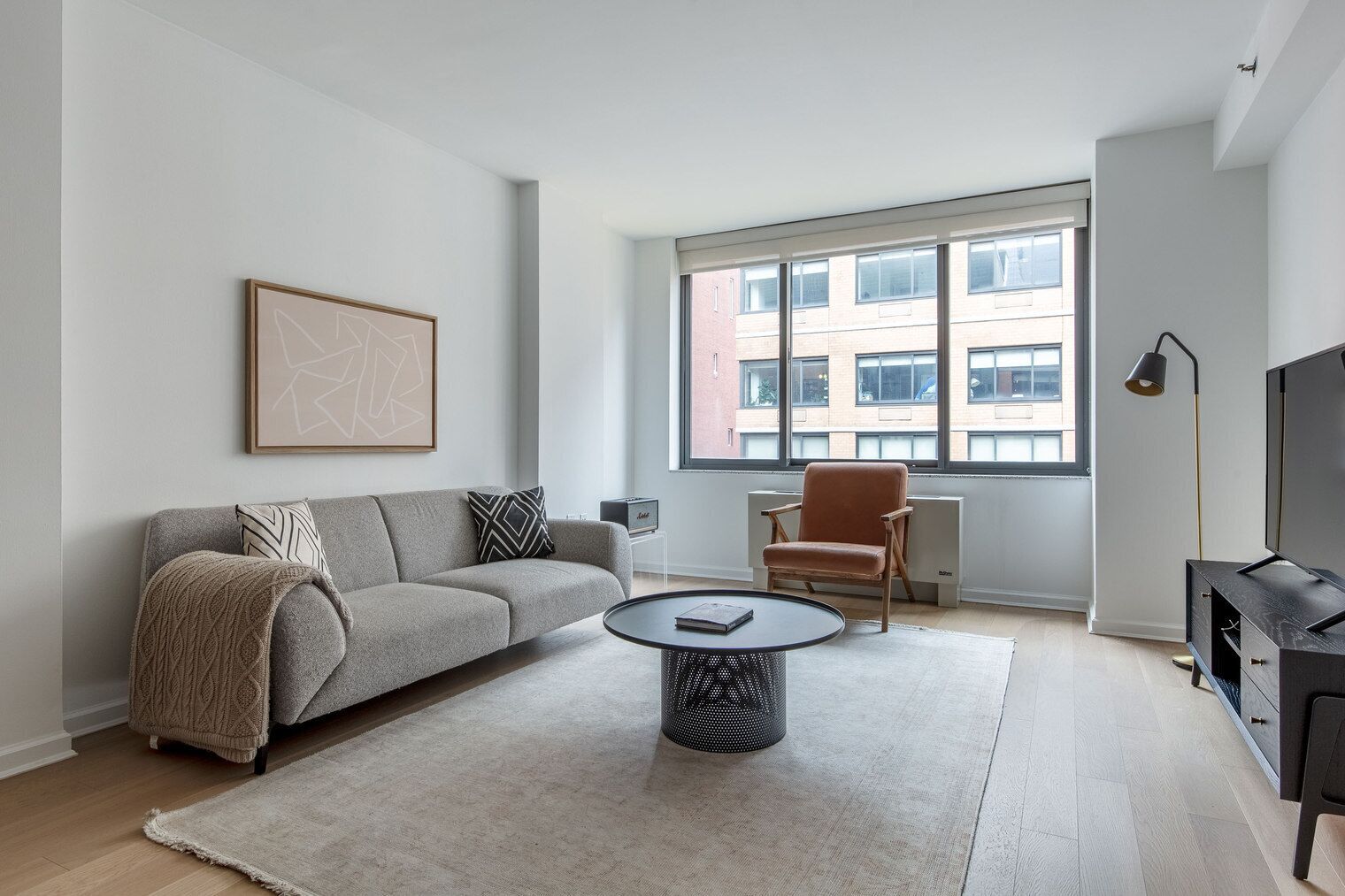 Open Chelsea 2BR w/ Gym & W/D, nr Park, by Blueground