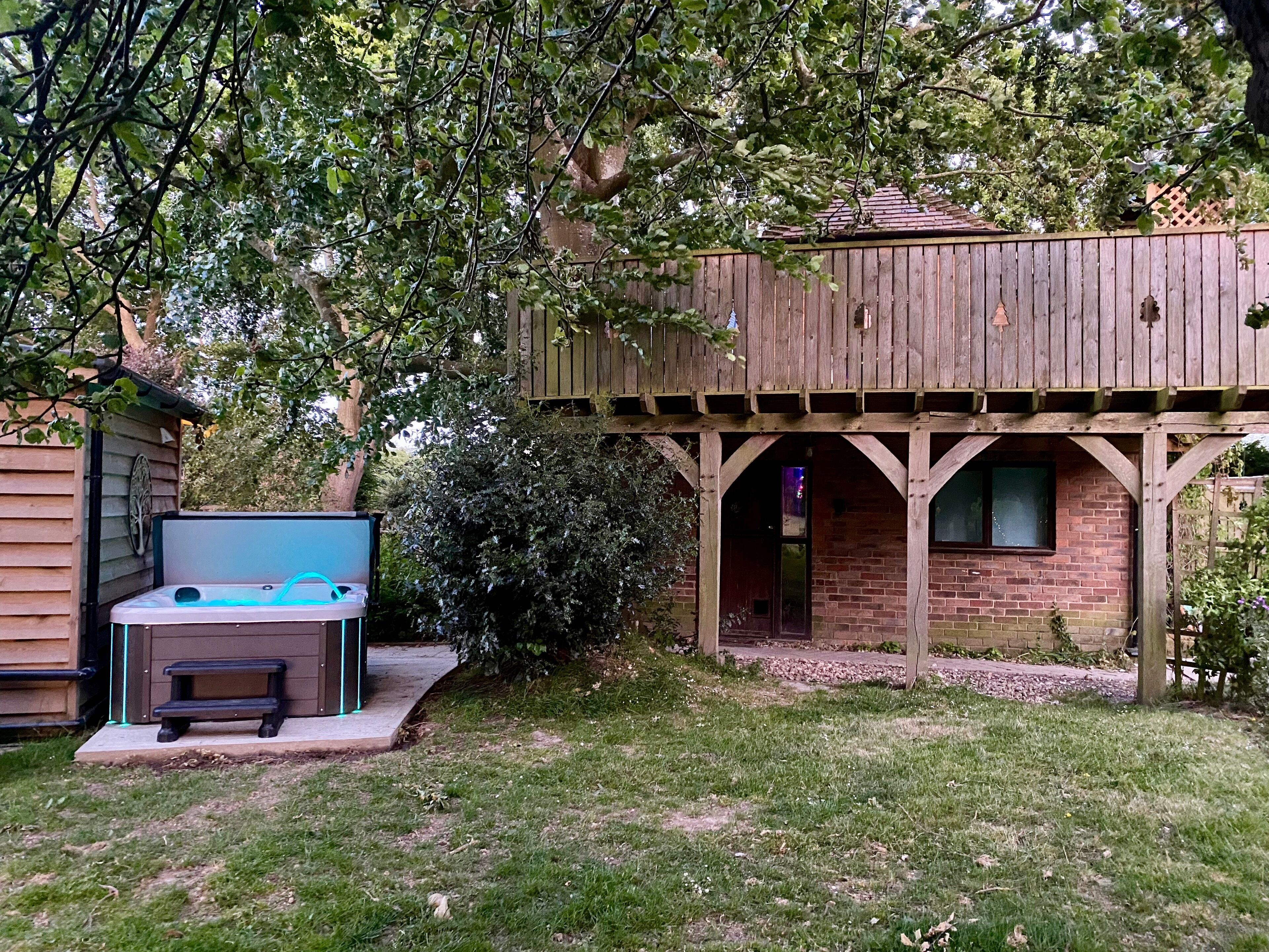 Studio & balcony with tree growing through it, spiral staircase, stunning views.