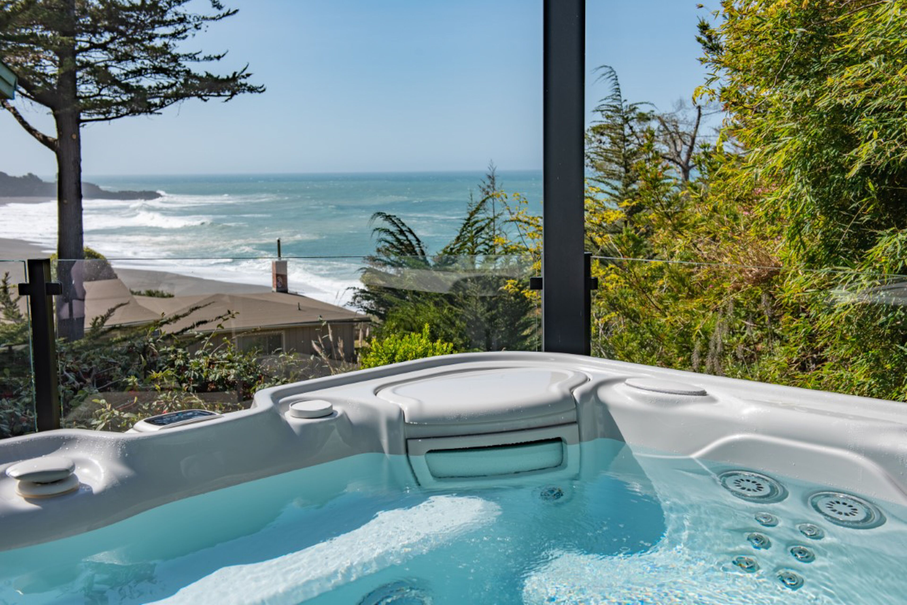 Upscale ocean view studio right in town with stunning private backyard