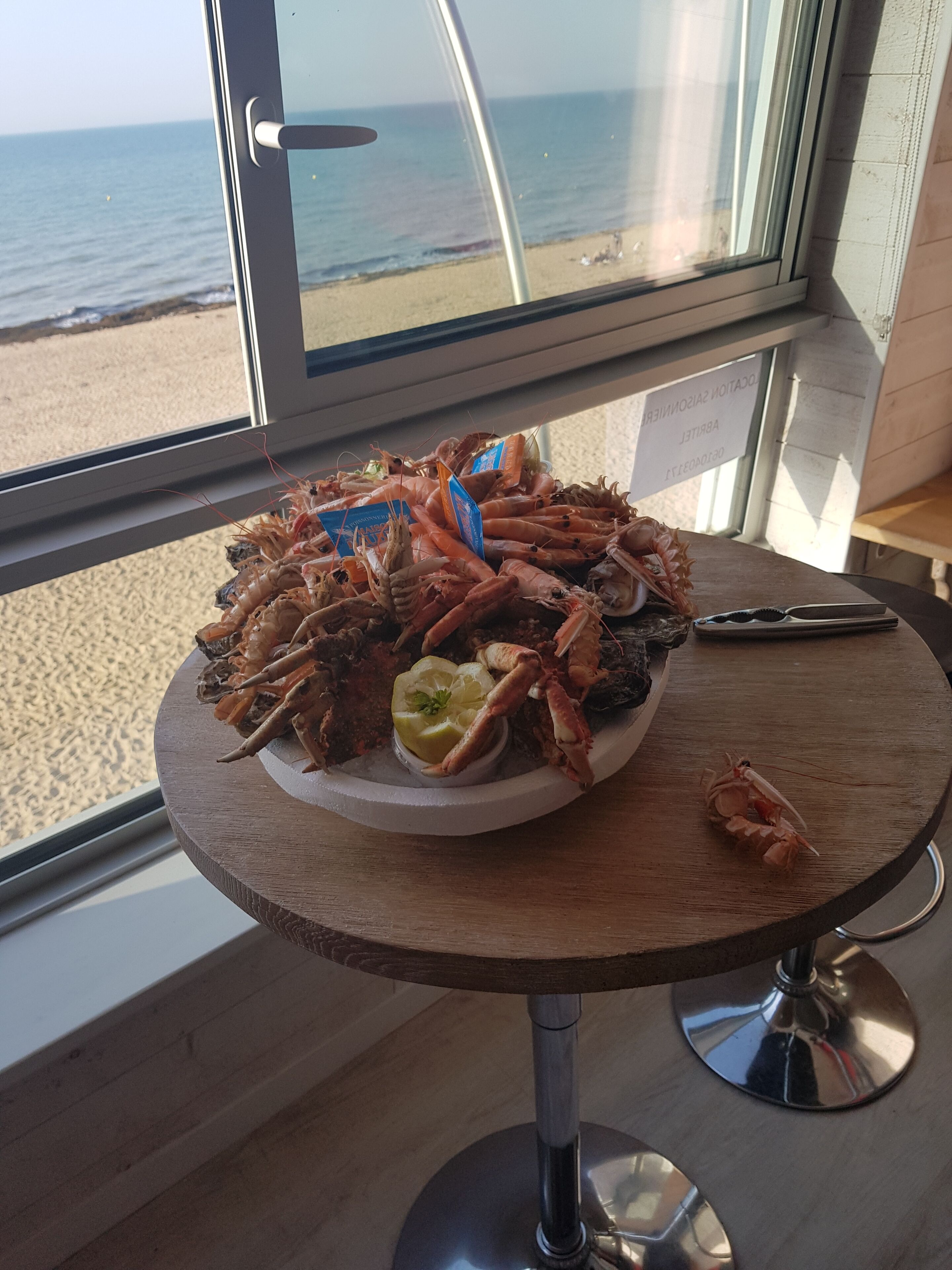 The feet in the water in Courseulles in Normandy, beach of Juno Beach