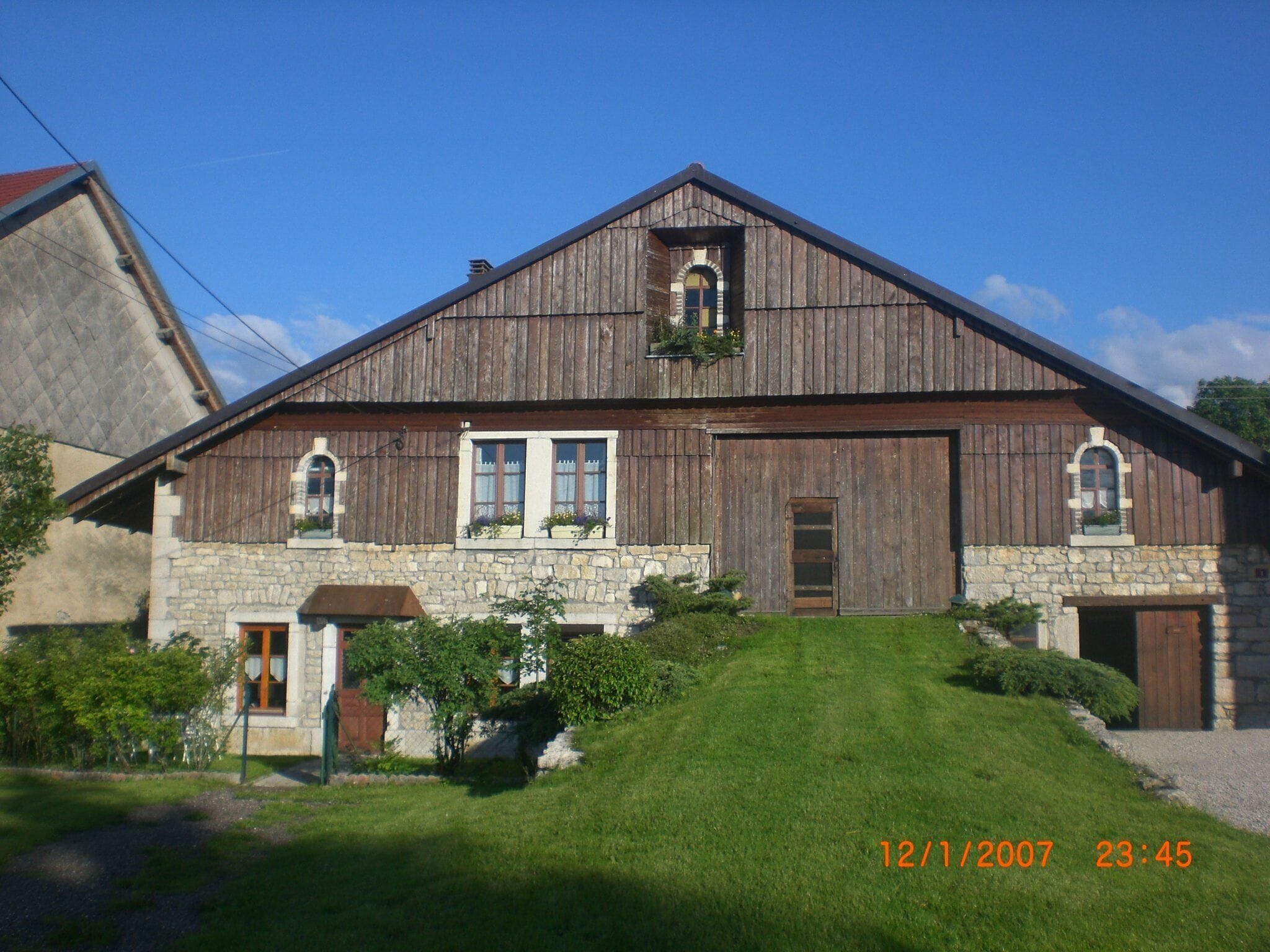 old renovated Comtoise farm in La Chenalotte, a village 20 km from Switzerland