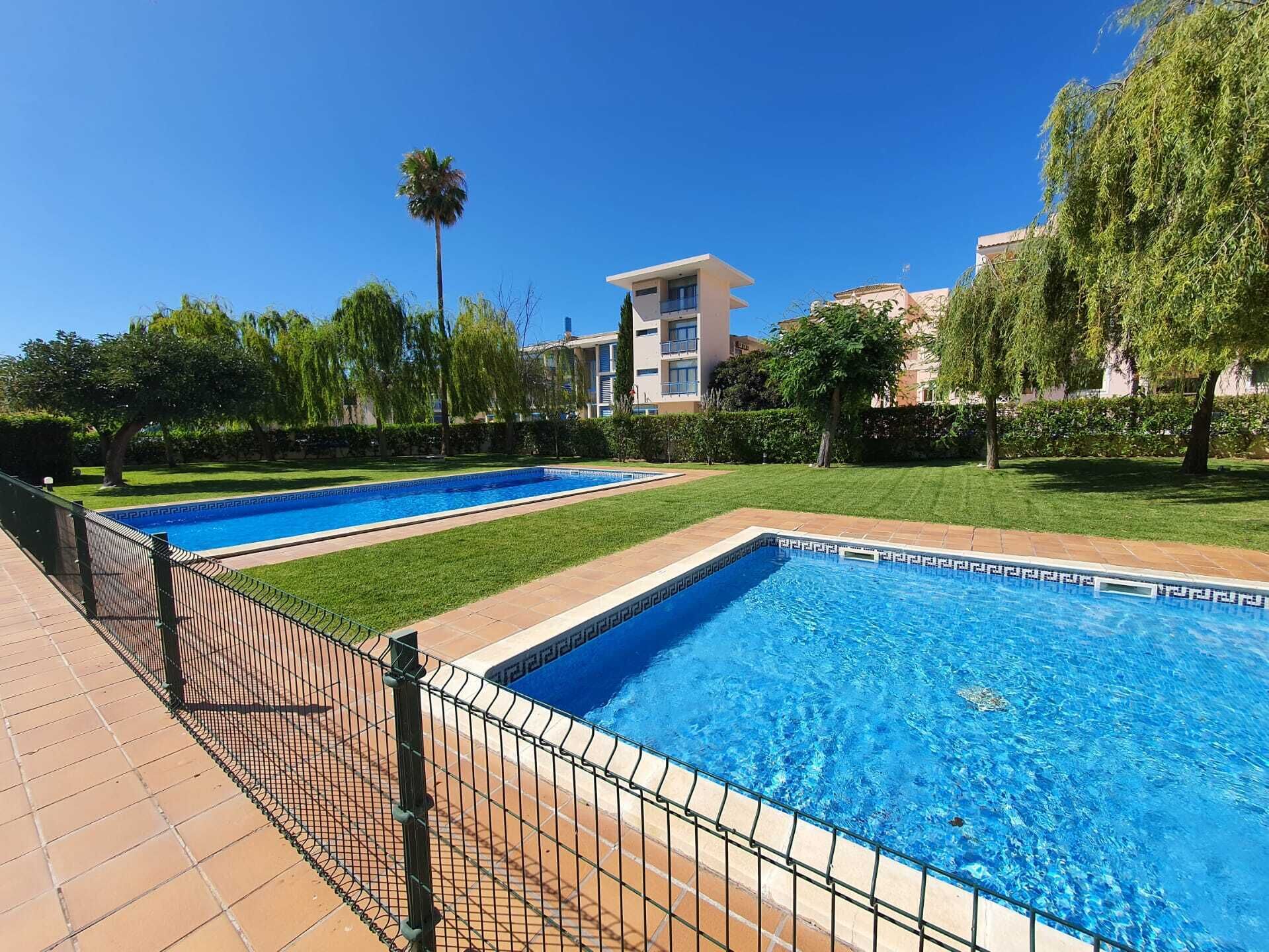 Apartment in lovely setting with two pools