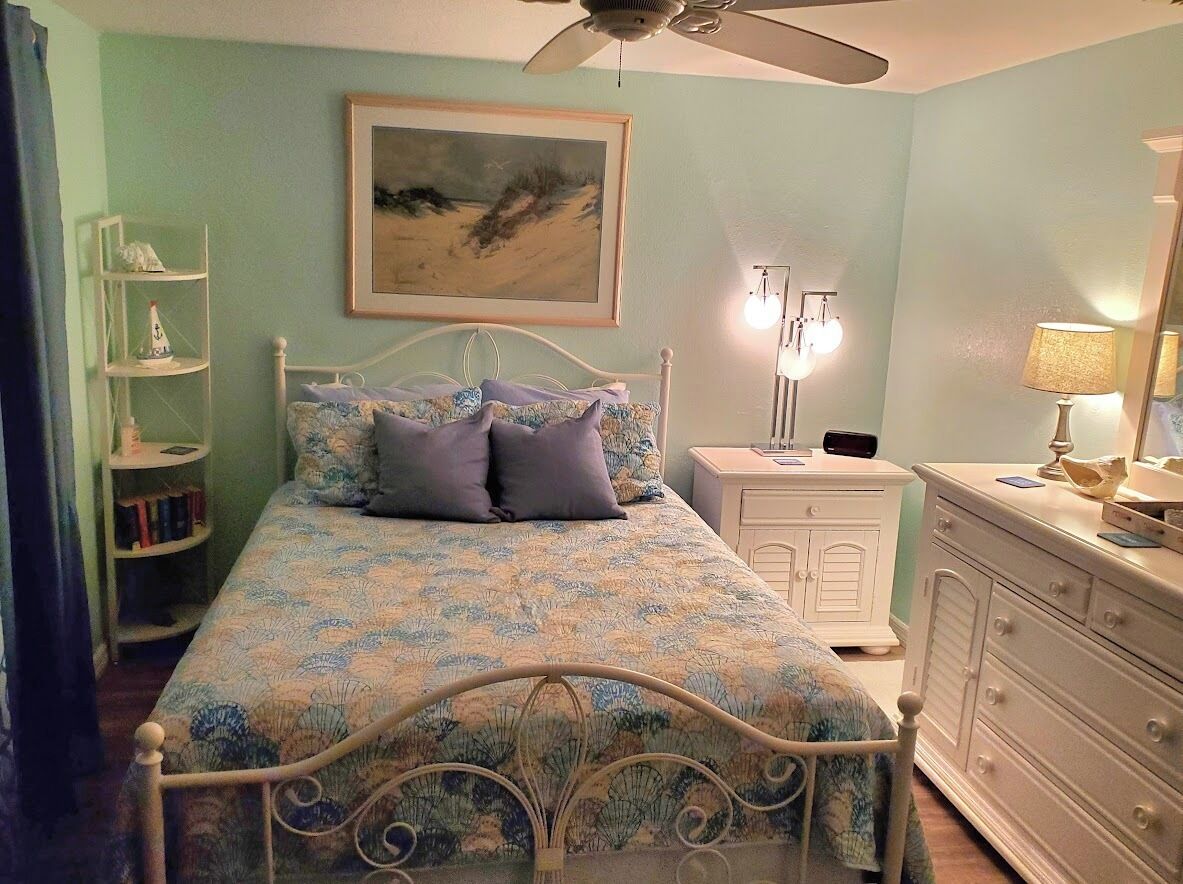 Private bedroom and private bath at separate end of home with water views.