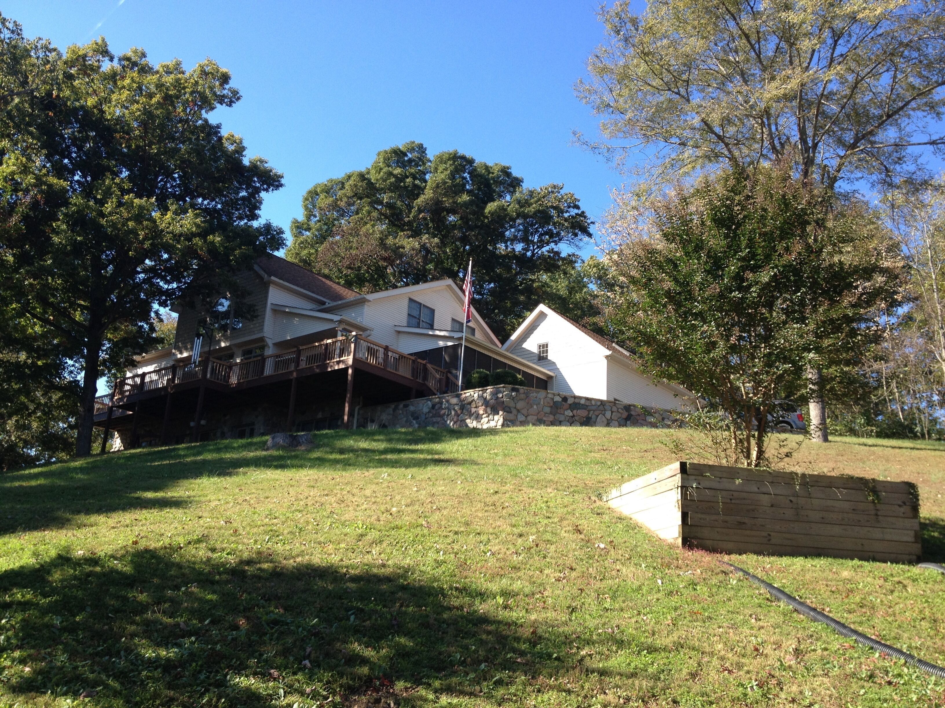 Private country hillside setting surrounded by trees, birds, wildlife pond/falls