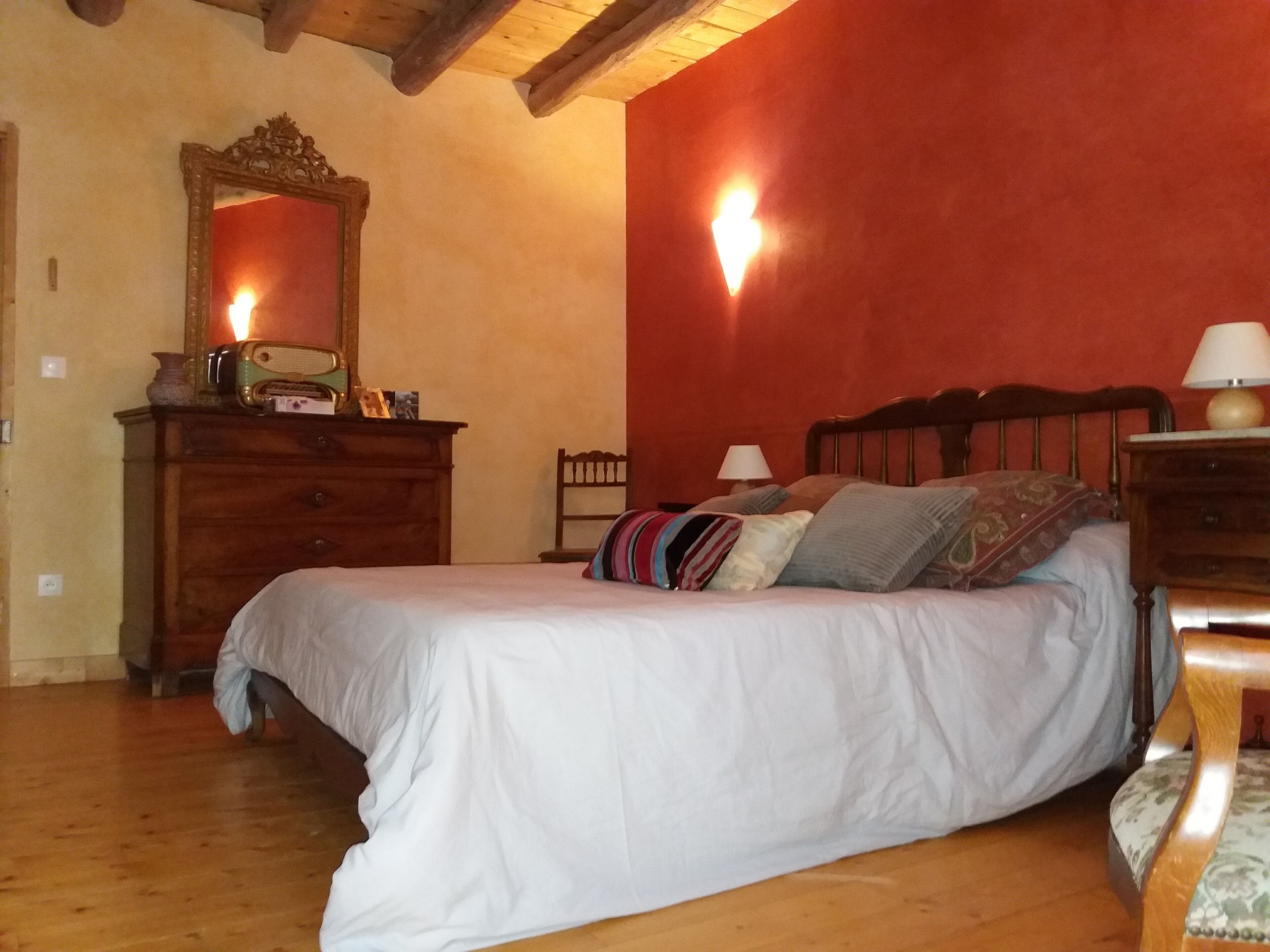 The eighteenth century house is opposite the fortified church of the village.