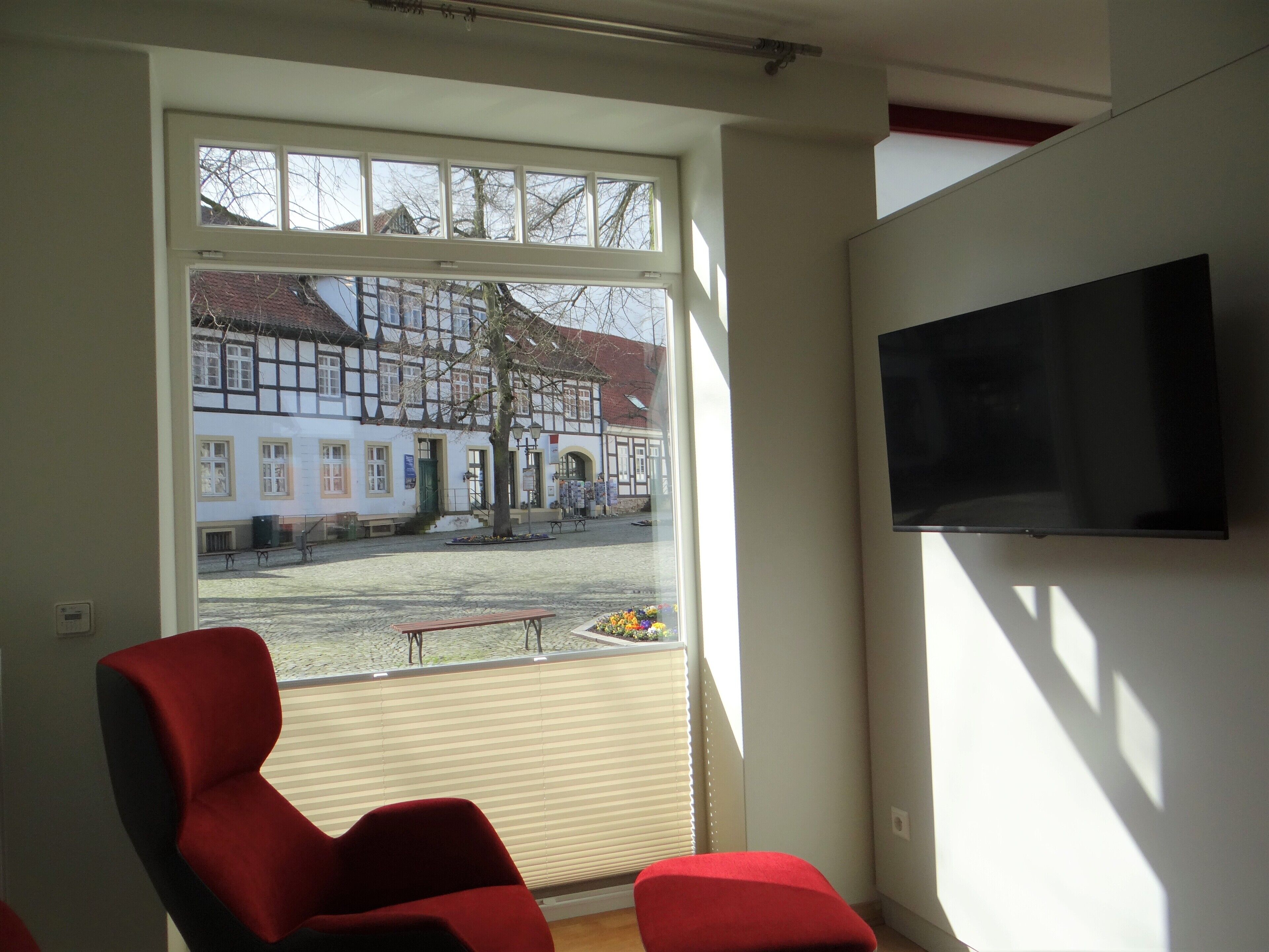 Modern apartment with a fireplace in a listed half-timbered house on the market square