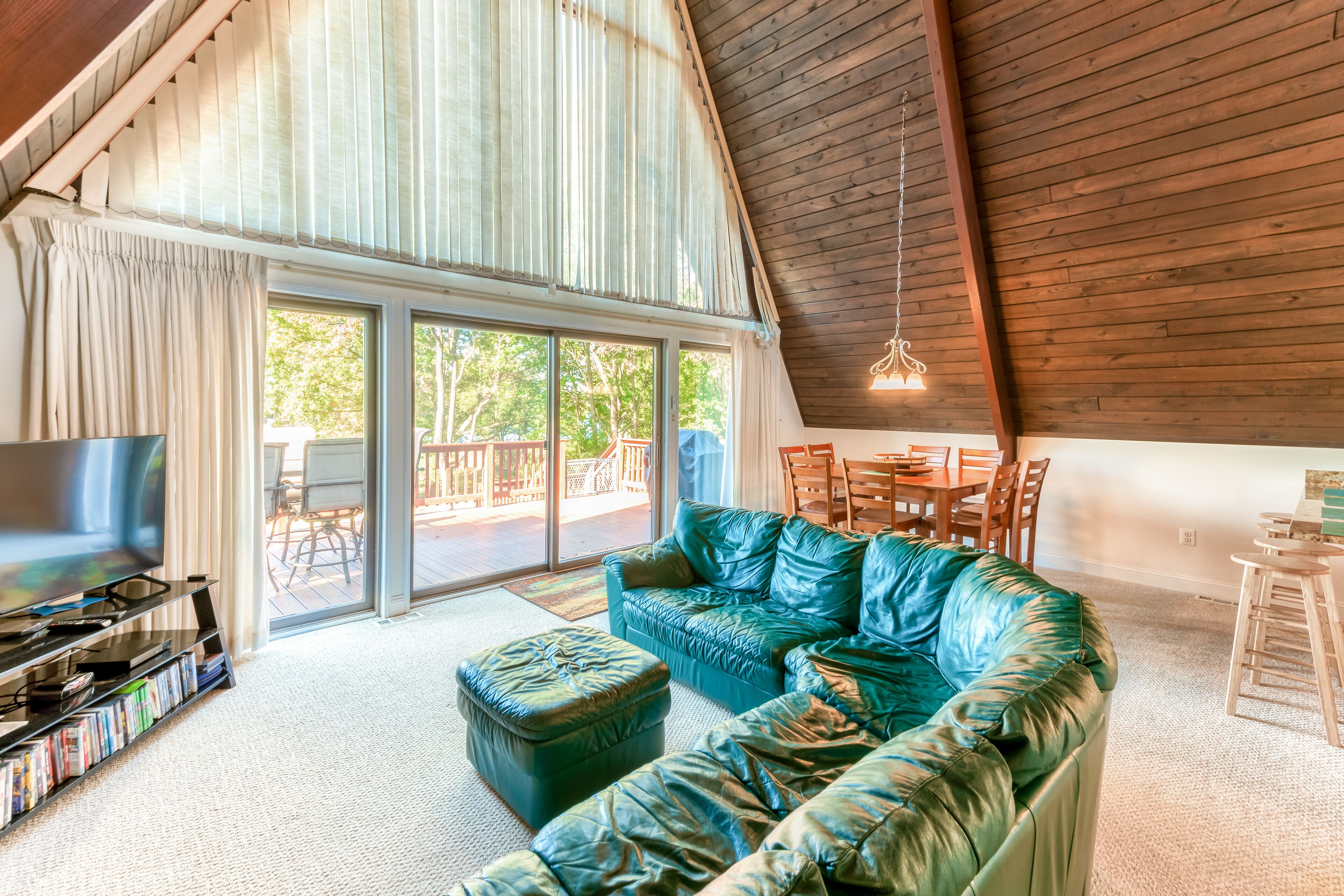Charming, lakefront A-frame with private dock, lakeside gazebo, spacious deck
