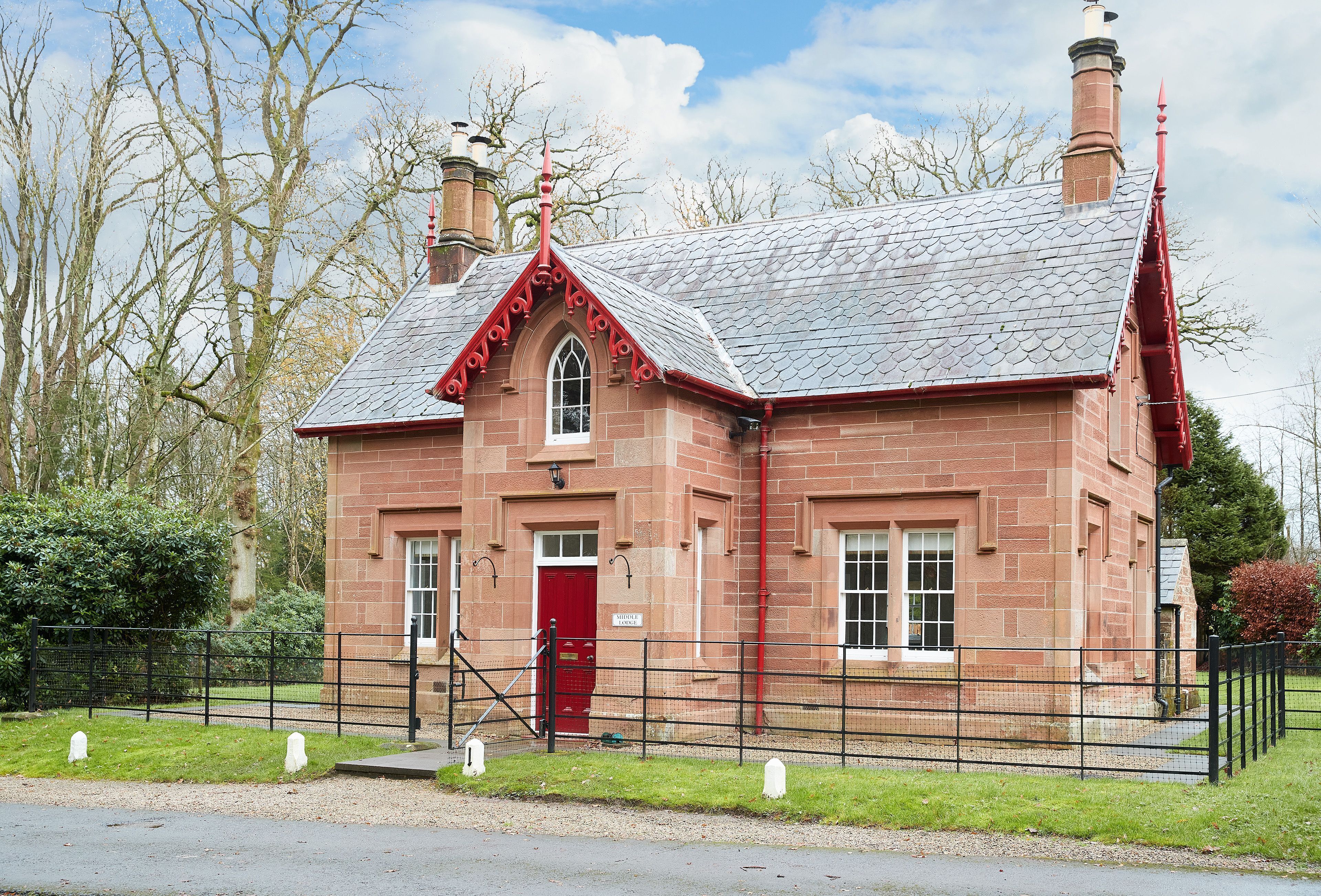 Beautifully restored former gatehouse standing proudly at the entrance