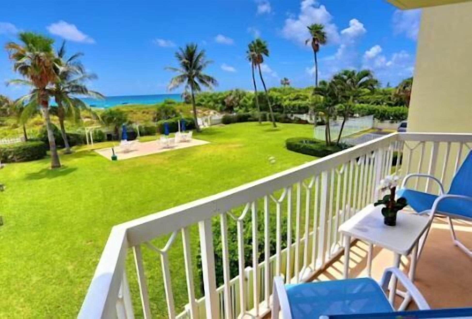 Oceanfront living at its best, with private beach and pool access.