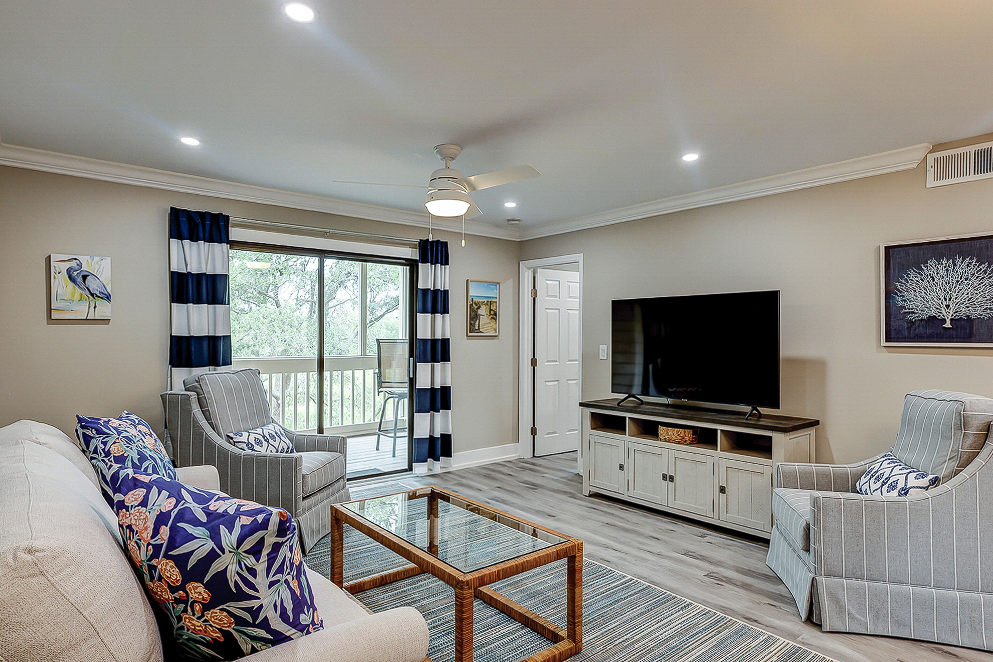 Fully updated condo with serene view, enclosed balcony, WiFi, W/D, pool, & gym