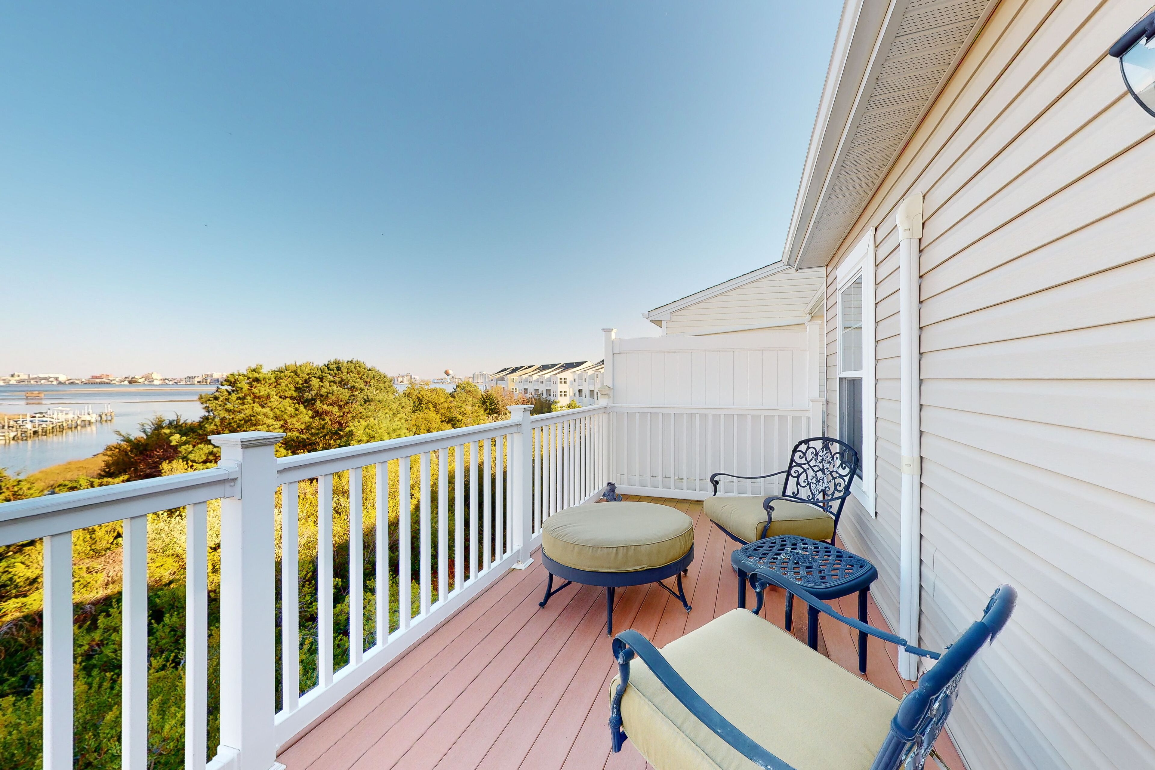 Bay-view townhome with pool & private outdoor living - walk to dining