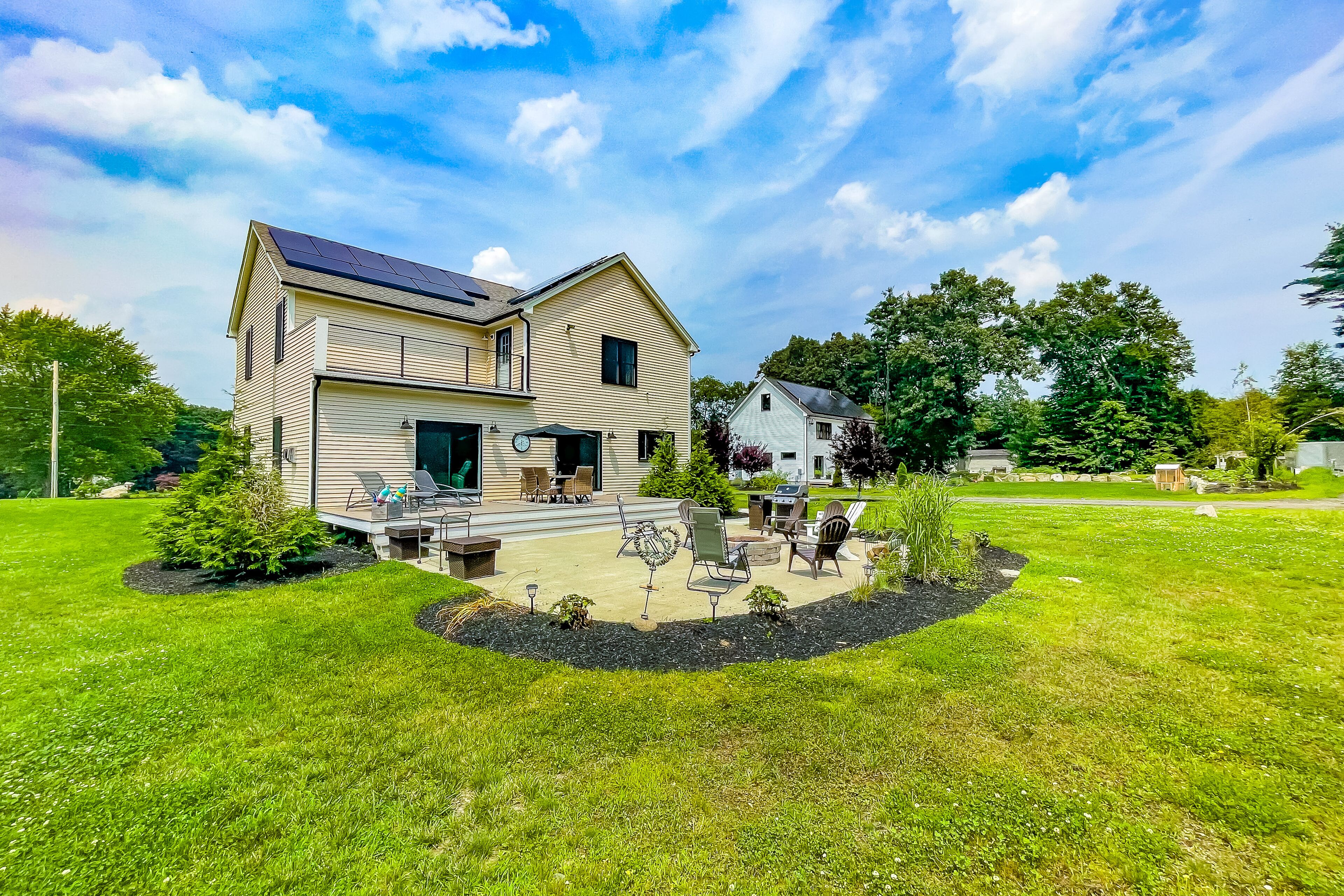 Inviting house in Salisbury with EV charger, balcony, firepit, and gas grill