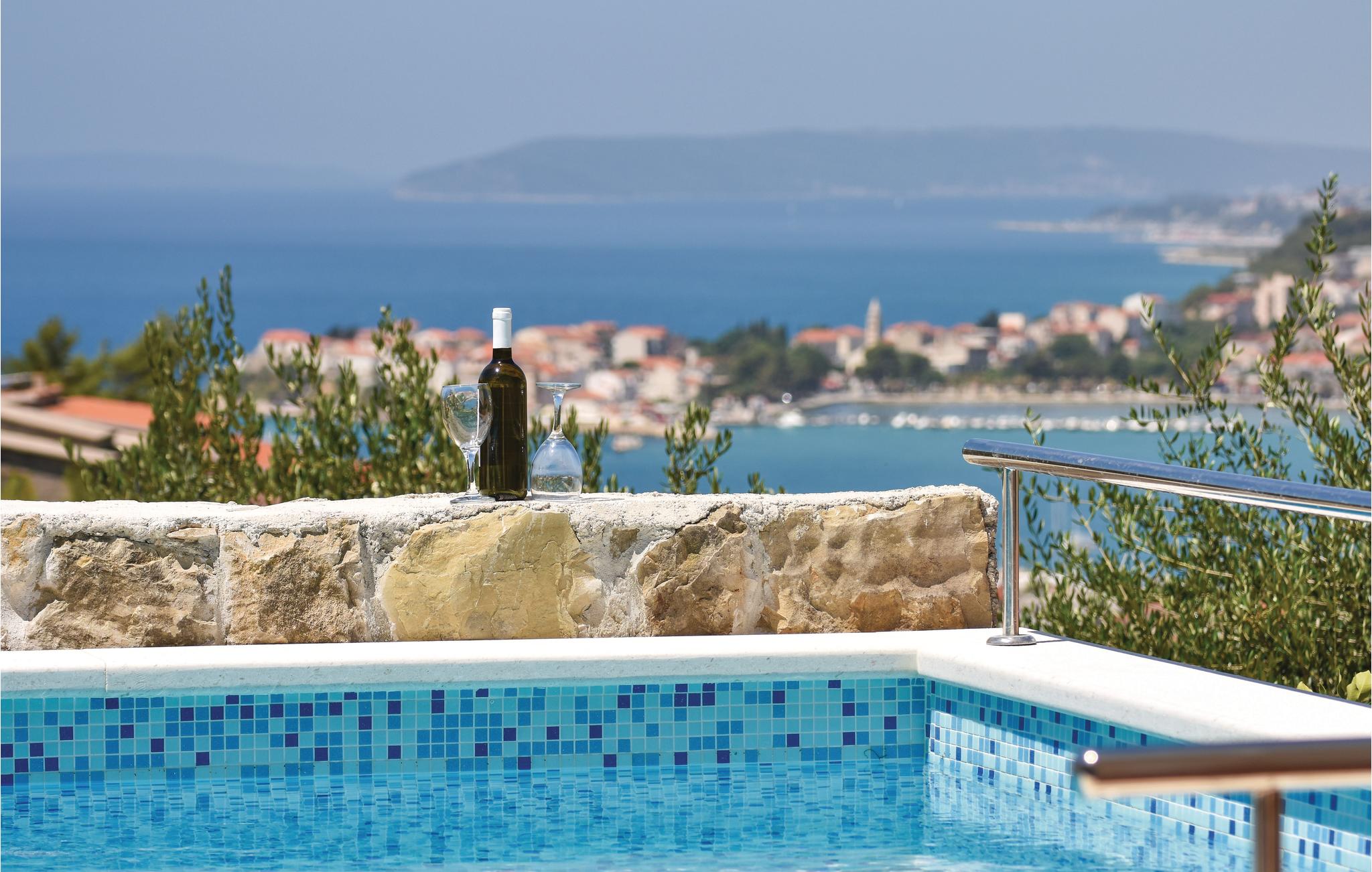 Awesome apartment in Podstrana with 4 Bedrooms, WiFi and Outdoor swimming pool