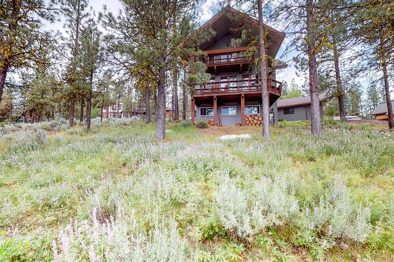 Spacious family home with shared pool, tennis courts, and treelined views