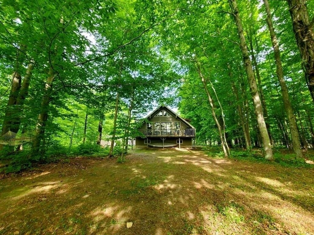 On the Betsie River, fish off dock, close to Crystal Mountain, trails, lakes!